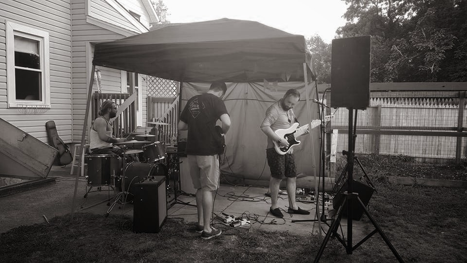Darkroom Honeymoon performing under a canopy at Bands Without Borders, July 17, 2016